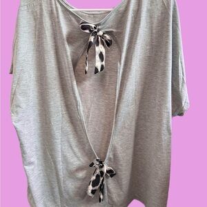 Women’s cute shirt check out the back  open with bows